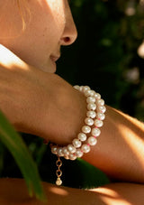 Freshwater Pearl Bracelet with a Neon Pink Thread