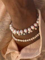 Freshwater Pearl Bracelet with a Neon Pink Thread