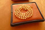 Fine Freshwater Pearl Necklace with a Gold Thread